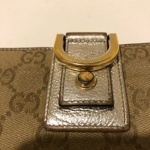 Gucci wallet in metallic leather and GGfabric